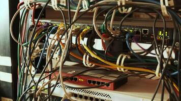 Network switch and ethernet cable in rack cabinet. Network connection technology and has a status LED to show working status. Concept of infrastructure with cables connected to data center 9 video
