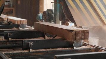 Sawing machine at wood production factory. Timber material processing and cutting at sawmill. Manufacturing process at lumber mill. Automatic Circular Sawing Machine 2 video