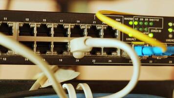 Network switch and ethernet cable in rack cabinet. Network connection technology and has a status LED to show working status. Concept of infrastructure with cables connected to data center 3 video