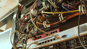 Network switch and ethernet cable in rack cabinet. Network connection technology and has a status LED to show working status. Concept of infrastructure with cables connected to data center 10 video
