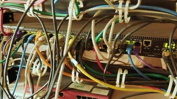 Network switch and ethernet cable in rack cabinet. Network connection technology and has a status LED to show working status. Concept of infrastructure with cables connected to data center 7 video