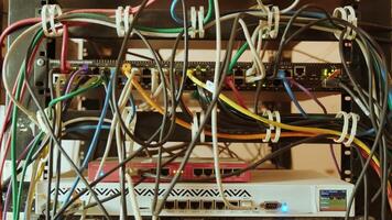 Network switch and ethernet cable in rack cabinet. Network connection technology and has a status LED to show working status. Concept of infrastructure with cables connected to data center 12 video