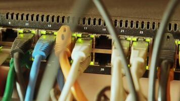 Network switch and ethernet cable in rack cabinet. Network connection technology and has a status LED to show working status. Concept of infrastructure with cables connected to data center 14 video