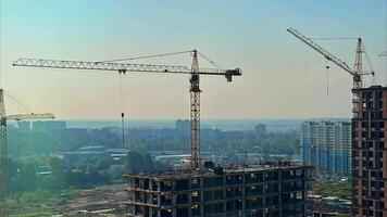 Construction cranes in the city video