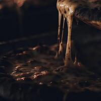 A close up of a pizza being lifted from a pan photo