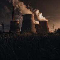 A coal power plant with smoke coming out of the chimneys photo