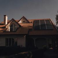 A house with solar panels on the roof photo