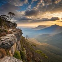 The sun sets over the blue mountains in australia photo