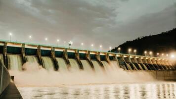 A large dam with water flowing over it photo
