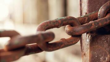 A rusty chain is attached to a rusty door photo