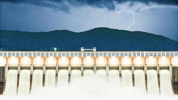 A large dam with water coming out of it photo