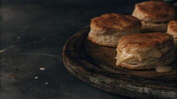 Biscuits on a wooden plate with butter photo
