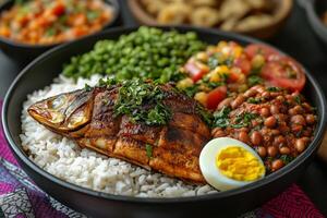 Ghanaian waakye , rice and beans, served with fried fish, boiled eggs, and shito, spicy sauce photo