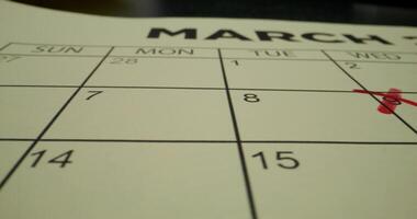 A calendar with a red cross on it photo