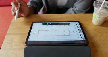 A person holding a pen and a tablet computer photo