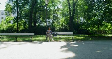 A person standing on a bench photo