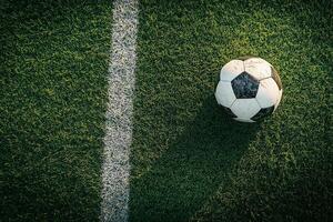 Soccer Ball on Green Grass Field with White Line photo