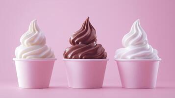 three different ice cream cups with chocolate and vanilla toppings photo