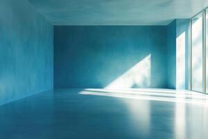 Minimalist blue empty room with sunlight streaming through large windows. photo