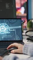 Vertical Call center agent uses artificial intelligence to enhance customer interactions and resolve inquiries efficiently. Woman in customer service office using AI communication technologies, camera A video