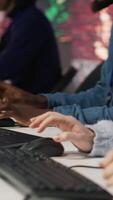 Vertical Call center worker using artificial intelligence customer service management software. Customer service agent using AI technology to log customer interactions in CSM system, camera A video