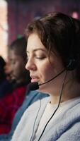 Vertical Account manager handling customer inquiries, complaints and support requests in office. Customer service worker assists customers with issues related to products or services, camera B extreme closeup video