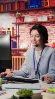 Vertical Customer support workers doing upselling, recommending products to clients during conversation. Call center agents contact prospects to inform them about new services and promotions, camera B close up video