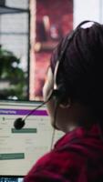Vertical Call center worker in office using AI chatbot to provide quick replies to common customer queries. Woman doing customer service job generating automated responses to clients using AI, camera A video