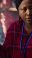 Vertical Call center agents using artificial intelligence tech to provide step by step guidance to customers. Customer center coworkers using AI technology to walk clients through technical solutions, camera A video