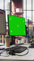 Vertical Customer support office with green screen PC used to assist customers with technical issues and diagnosing problems. Call center workspace with chroma key computer used to do complaint resolution video