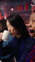 Vertical Senior account manager teaching intern how to talk with customers to identify sales opportunities. Experienced team leader helping new trainee in office to generate leads, camera B video