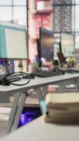 Vertical Audio equipment communication gear used in customer center workspace, close up shot. Headphones with microphone in call center environment office next to keyboards on desk video