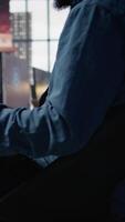 Vertical Customer center expert uses AI assistant to generate technical solutions for clients. Call center agent uses artificial intelligence LLM chatbot to provide step by step guidance to customers, camera B video