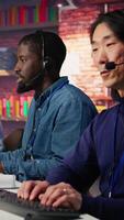 Vertical Technical support specialist in call center office using AI LLM chatbot to troubleshoot customer connectivity issue through step by step guidance, using artificial intelligence, camera B video