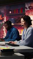 Vertical Call center employee handling customer complaints, offering helpful solutions to their concerns. Customer service agent providing helpful information related to products or services, camera B video