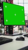 Vertical Isolated screen computer displays in customer support workplace, panning shot. Chroma key PC monitors in empty call center office where unsatisfied customers call to solve technical problems video