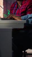 Vertical Call center coworkers brainstorming how to answer customers, using AI chatbot. Team of agents doing customer service job using artificial intelligence, working together, camera B video