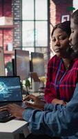 Vertical Call center manager teaching intern how to use AI to enhance customer interactions. Team leader in customer service office explaining trainee how to use artificial intelligence, camera B video