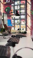 Vertical Customer support office with PC devices used to assist customers with technical issues and diagnosing problems. Call center workplace with computer used to do complaint resolution video