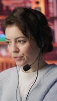 Vertical Customer support workers assisting clients to meet outbound call quotas and sales targets. Call center agents contacting prospects to inform them about new products, camera A video