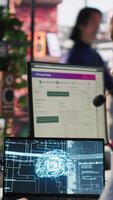 Vertical Worker providing live chat support, typing on keyboard, using AI chatbot to handle clients complaints. Call center agent dealing with unsatisfied customers using artificial intelligence LLM, camera A video
