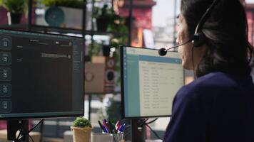 Call center agent using AI chatbot to provide quick and accurate replies to common customer queries. Customer service representative generating automated responses to clients using AI, camera A video