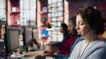 Account manager handling customer inquiries, complaints and support requests in office. Customer service worker assists customers with issues related to products or services, camera B extreme closeup video