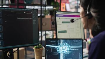 Customer center employee uses artificial intelligence LLM assistant to locate clients packages. Call center agents track shipments in office, using AI chatbot to generate solutions, camera A video
