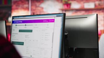 Teamworking cheerful call center agents tracking shipments in office. Upbeat customer center colleagues use software to locate clients packages and provide status updates, camera A close up video