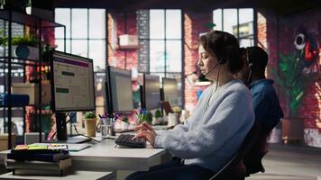 Customer support workers assist customers with technical issues by diagnosing problems. Call center agents wearing headphones in office doing deescalation and complaint resolution video