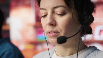 Closeup of account manager handling customer inquiries, complaints and support requests in office. Customer service worker assists customers with issues related to products or services, camera A video