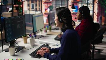 Experienced call center employee listening to customer inquiries and complaints. Asian senior customer service representative assisting customers with issues related to products or services, camera B video