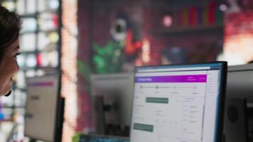 Team of call center agents tracking shipments in office, handling delivery delays. Customer center coworkers use software to locate clients packages and provide status updates, camera A video