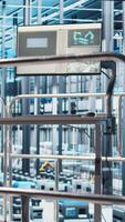 Vertical Tracking software displayed on monitor in industry 4.0 industrial plant equipped with advanced sensors. Program on display in smart factory collecting and analyzing data, dolly up shot video